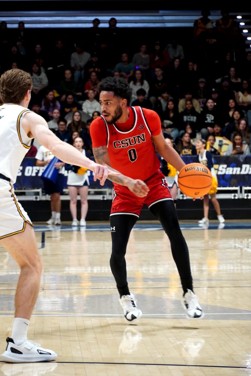 CSUN guard Tyler Beard (0) sizing up his defender vs. UC San Diego on Jan. 25, 2024.