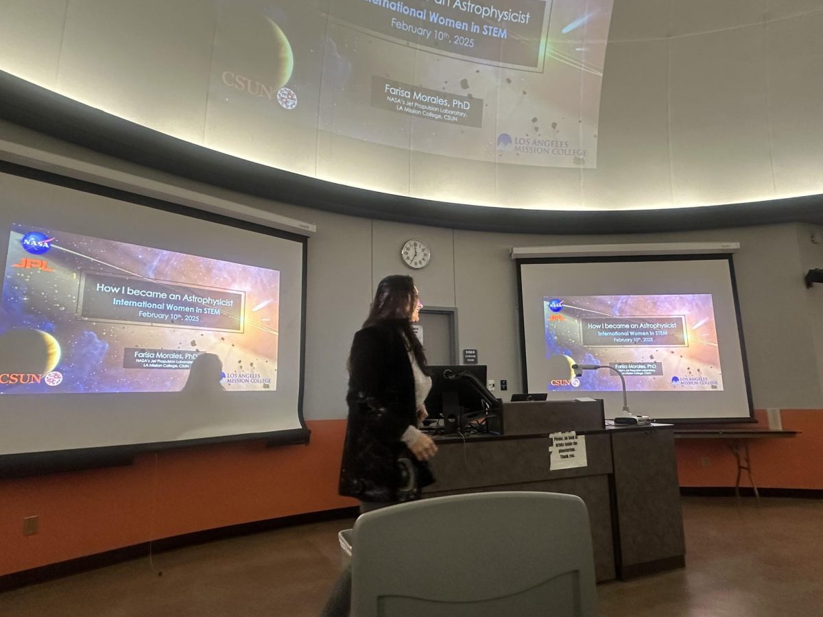 The second speaker of the night, Astrophysicist Farisa Morales, takes the stage with her presentation for the "Women in STEM" event on Feb. 10 at the CSUN Donald Bianchi Planetarium. Morales is also a professor at CSUN teaching astronomy. 