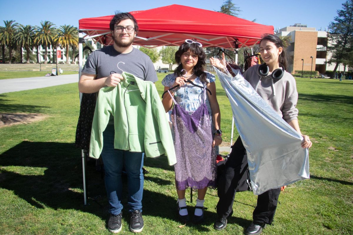 From left, Speech and Debate Team members, Vahe Tovmasian, Emily Ramirez and Isabella Mahon host a pop-up thrift store on Thursday, Feb. 20 at CSUN's Sierra Lawn. The proceeds from this event will go towards the conferences, debates and merchandise.