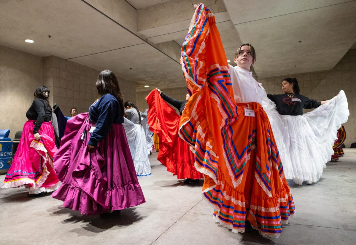 Ballet Folklórico Aztlán de CSUN member Brianna Martinez practices skirt work while rehearsing for dance region Veracruz Sotavento under Sierra Tower in Northridge, Calif., on Friday, Feb. 28, 2025.