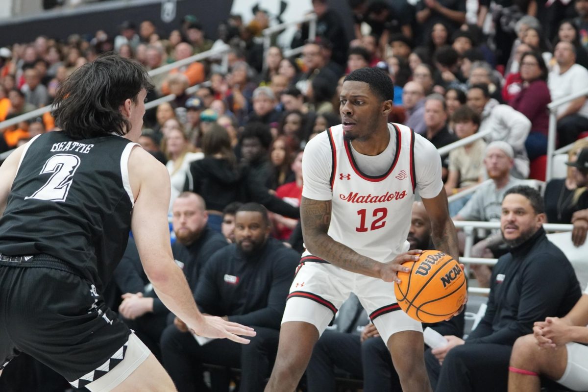 CSUN guard Scotty Washington, 12, reading the defense vs. Hawai'i at the Premier America Credit Union Arena on March, 8, 2025.