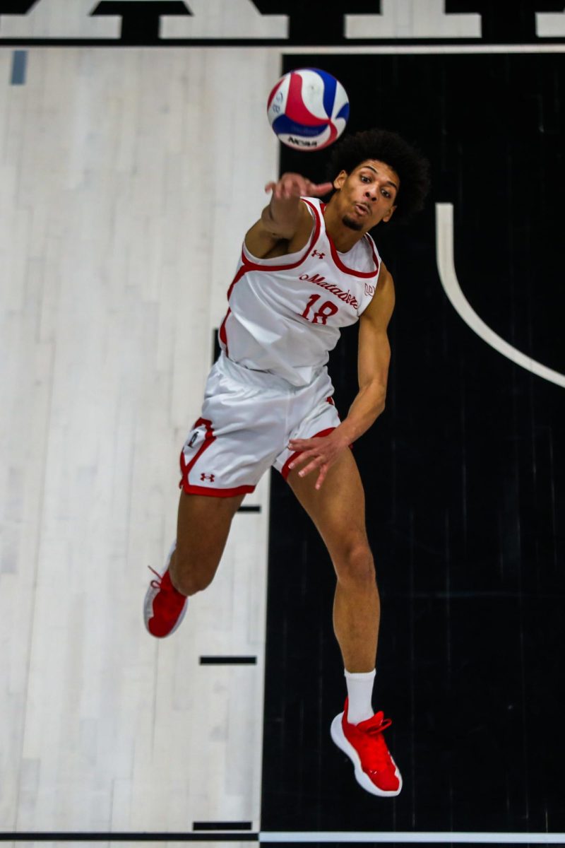 CSUN opposite Jalen Phillips, 18, serves the ball during a game against the USC Trojans at the Premier America Credit Union Arena in Northridge, Calif., on Wednesday, Jan. 22, 2025. The Matadors lost in four sets 3-1.