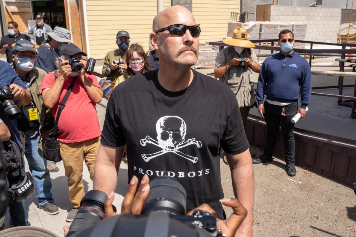 Basking in the attention, a member of the Proud Boys, a white supremacist known for using violence, stands to pose for photos. Sunday, April 11, 2021. (Photo by Solomon O. Smith/ The Valley Star)