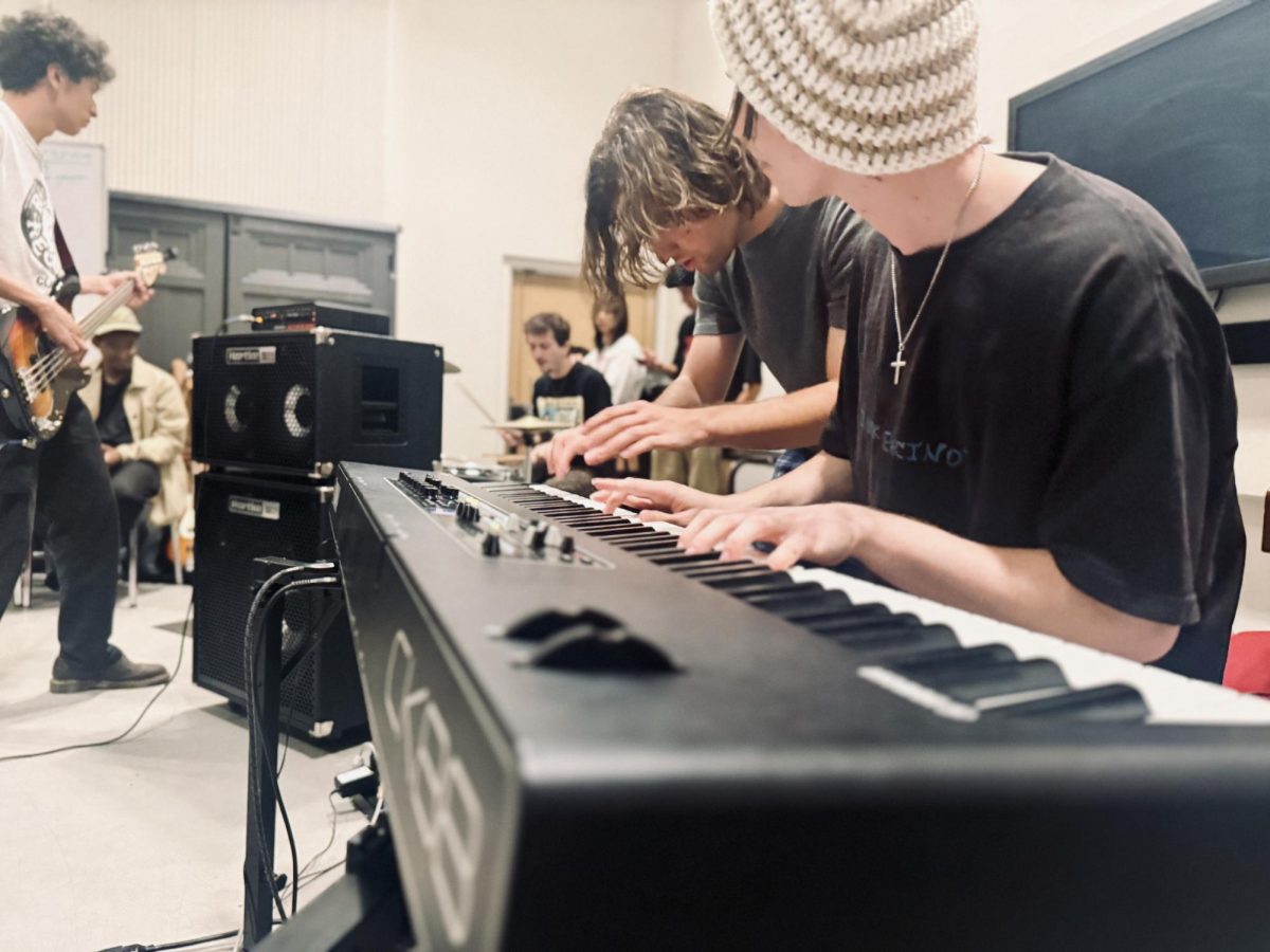 Wesley Simpkin (left) and Daniel Scanlon (right) simultaneously play the keyboard during "Thursday Night Jam" at Nordhoff Hall in Northridge, Calif., on Sept. 4, 2025.
