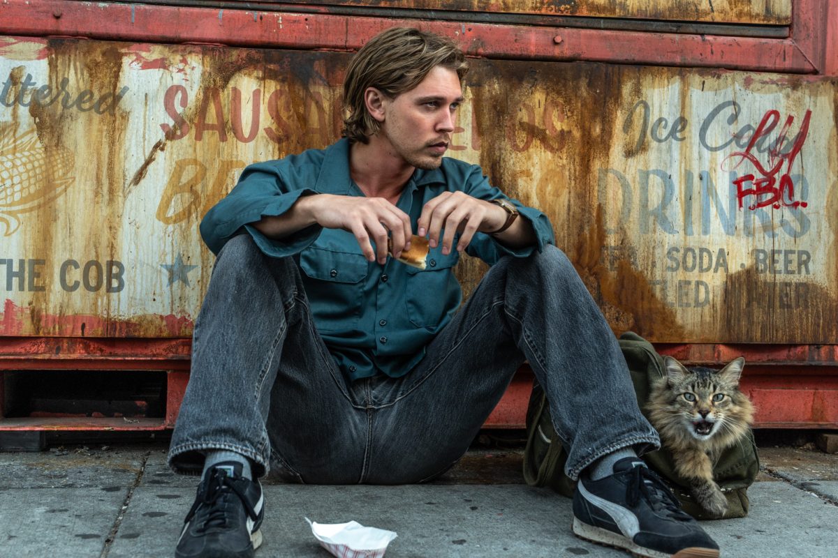 Austin Butler and Tonic the cat in a scene from “Caught Stealing.” Photo courtesy of IMDb.