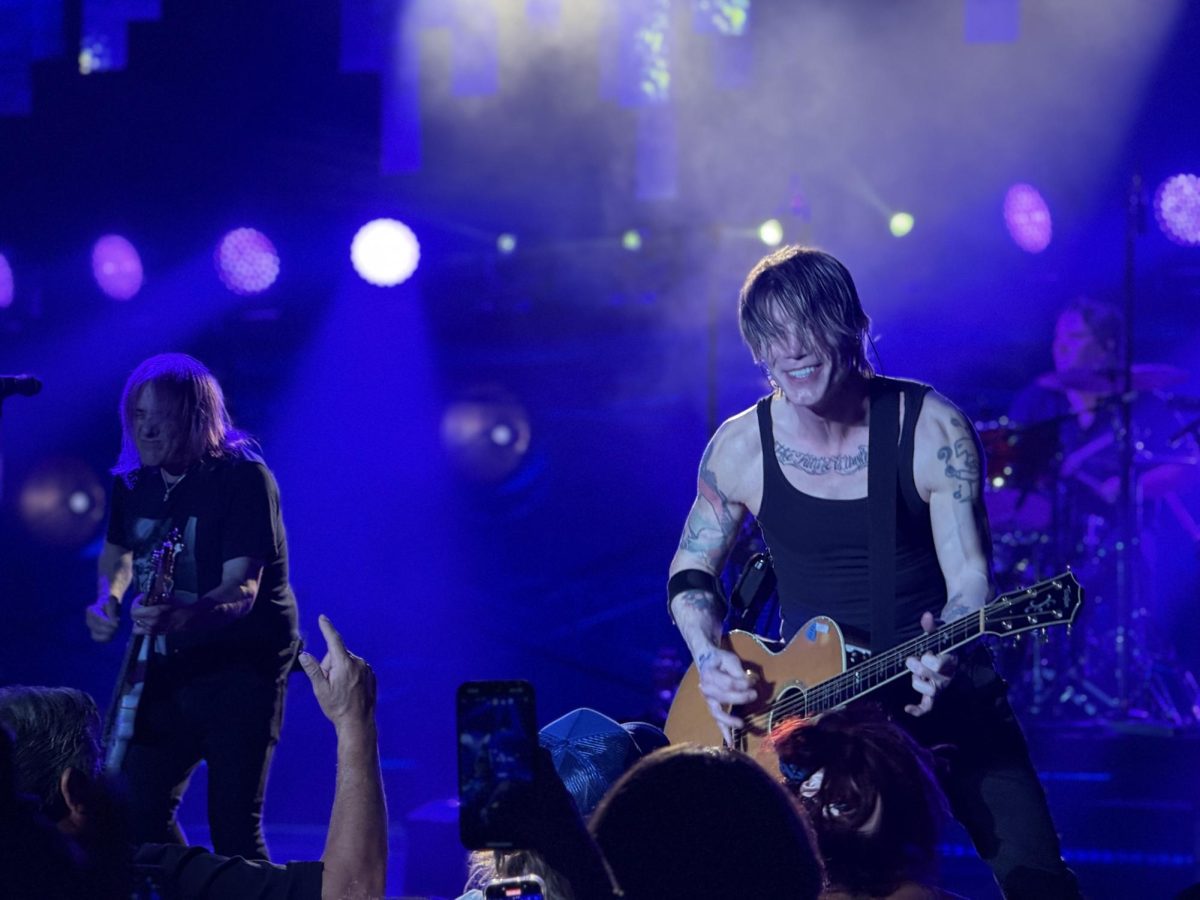 Robby Takac (left) and John Rzeznik (right) of the Goo Goo Dolls smile at the audience at the Greek Theatre in Los Angeles, Calif., on Sept. 7, 2025.