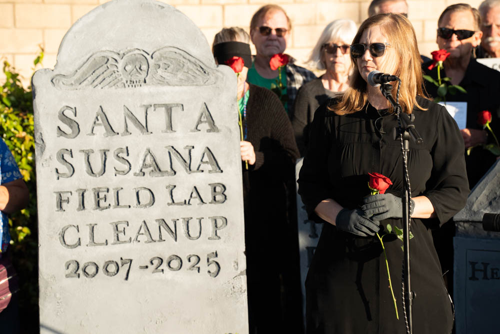 Melissa Bumstead holds a symbolic funeral protesting the end of cleanup procedures at the severely contaminated Santa Susana Field Lab. The lab site was a research and development facility for liquid-propellant rocket engines and nuclear reactors. After its closure in 2006, the area was left heavily contaminated. The site was also the origin of the Woolsey Fire in 2018. The ceremony was held at the Rancho Santa Susana Community Center in Simi Valley on Oct. 7, 2025.