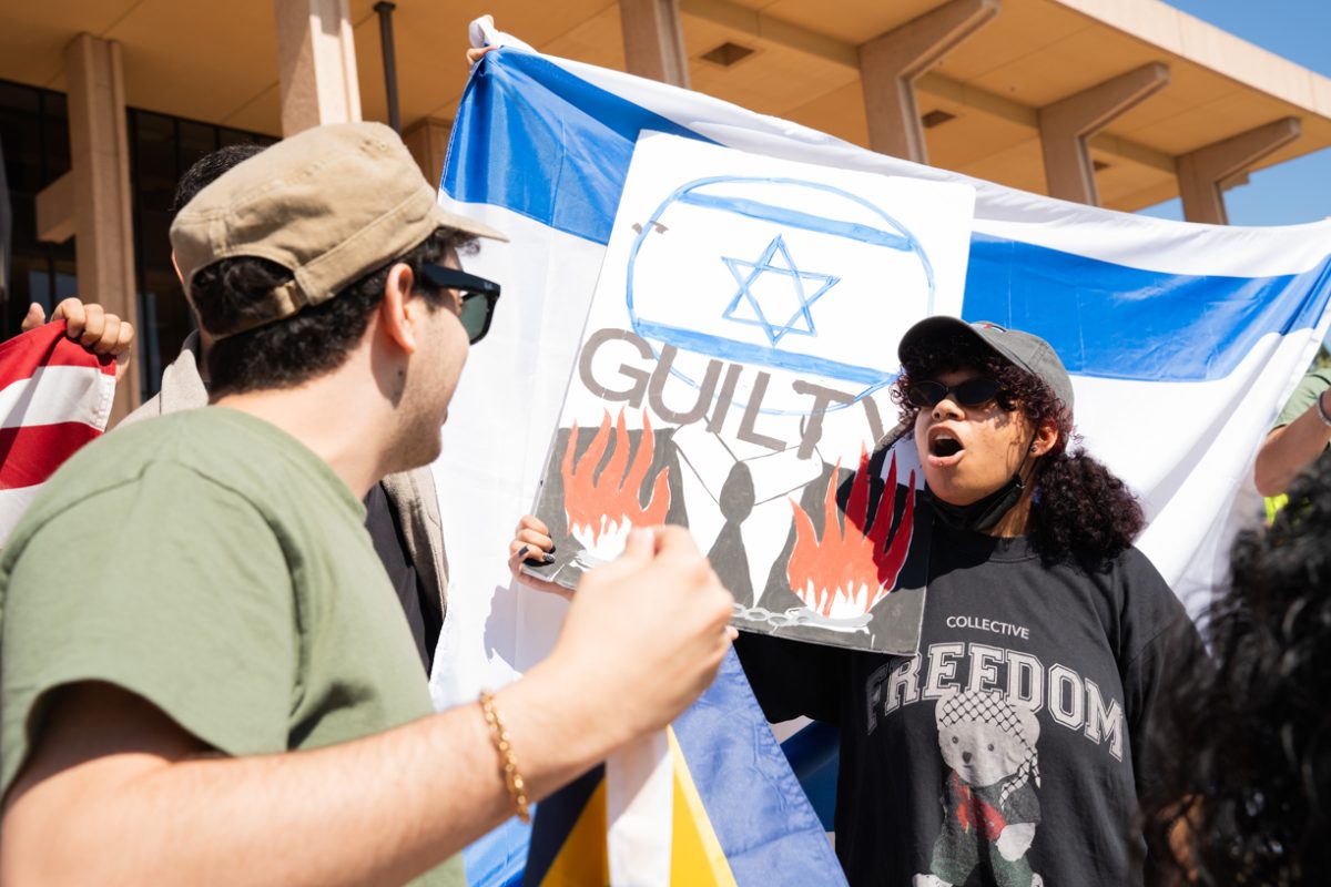 Pro-Israel protester (left) argues with pro-Palestine protester (right) at the SJP protest at CSUN on Oct. 7, 2025.