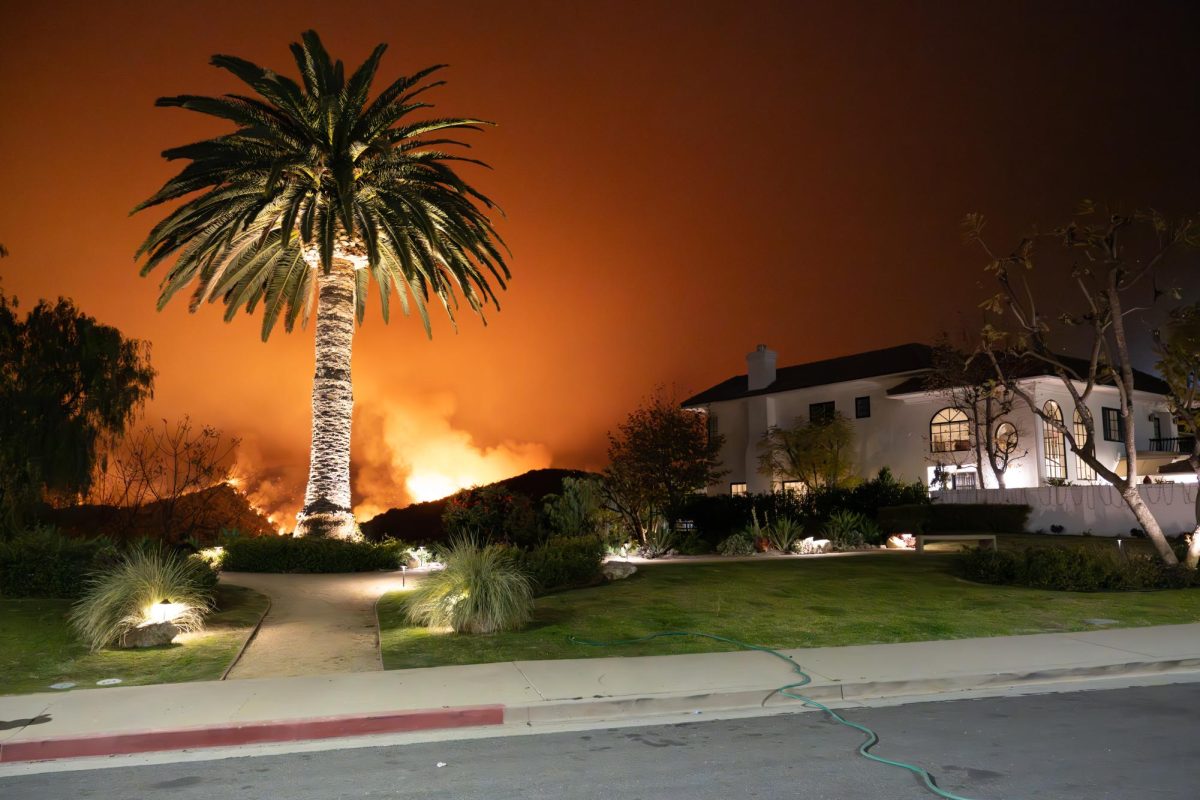 The Palisades Fire burns across the Santa Monica Mountains in the Mandeville Canyon neighborhood of Los Angeles, Calif., as seen from Mountaingate, on Friday, Jan. 10, 2025. 