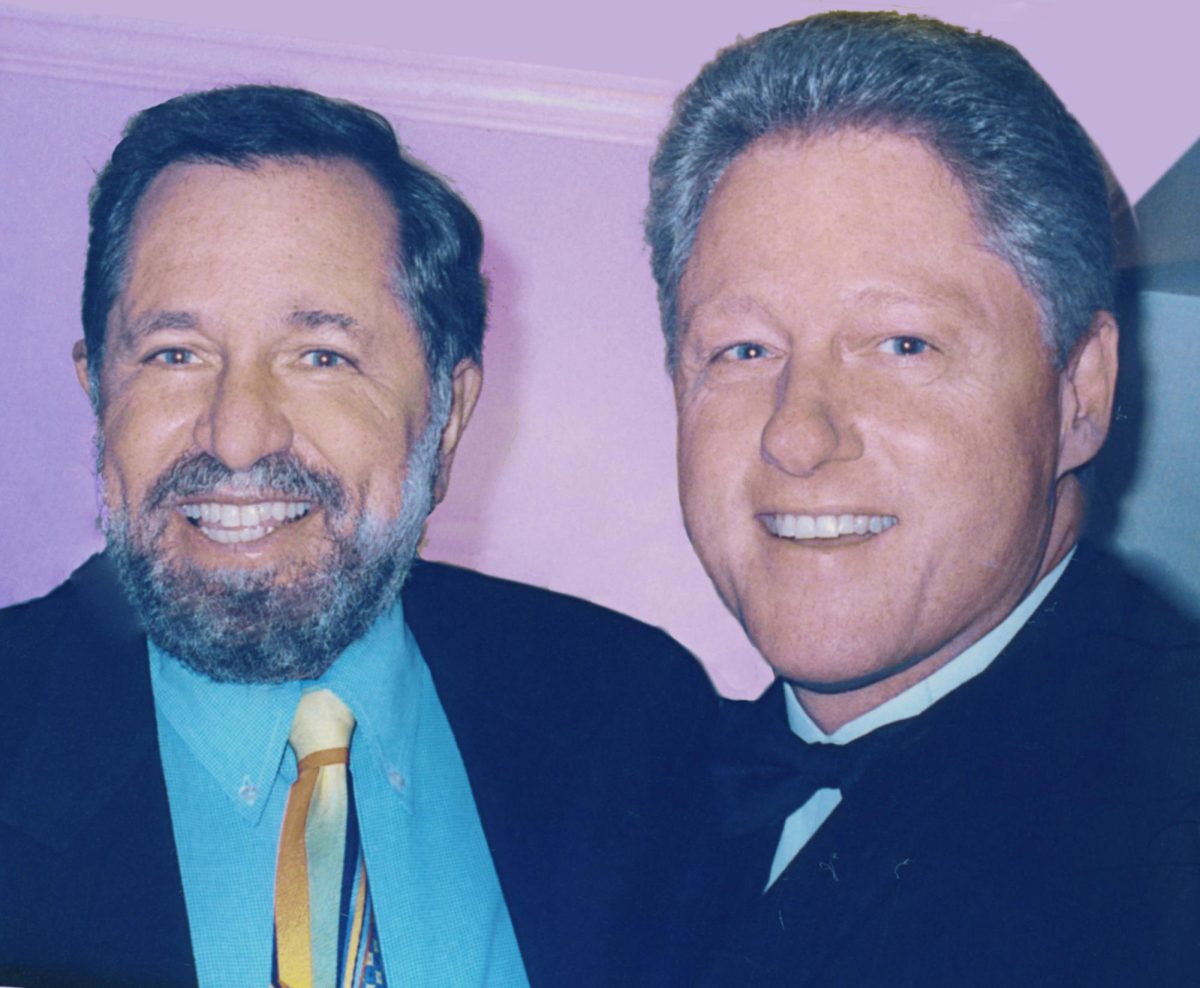David Obst and former President Bill Clinton smile for the camera at a Taylor Branch's birthday party, an author and close friend of the two. Image courtesy of Jane Gottlieb. 