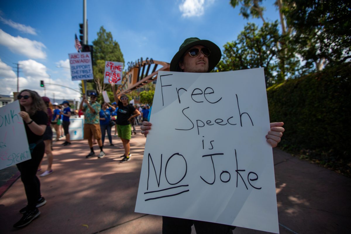 People gather during a protest of ABC's decision to remove Jimmy Kimmel Live! and anti-fascism in front of the Walt Disney Studios in Burbank on Sept. 19, 2025.