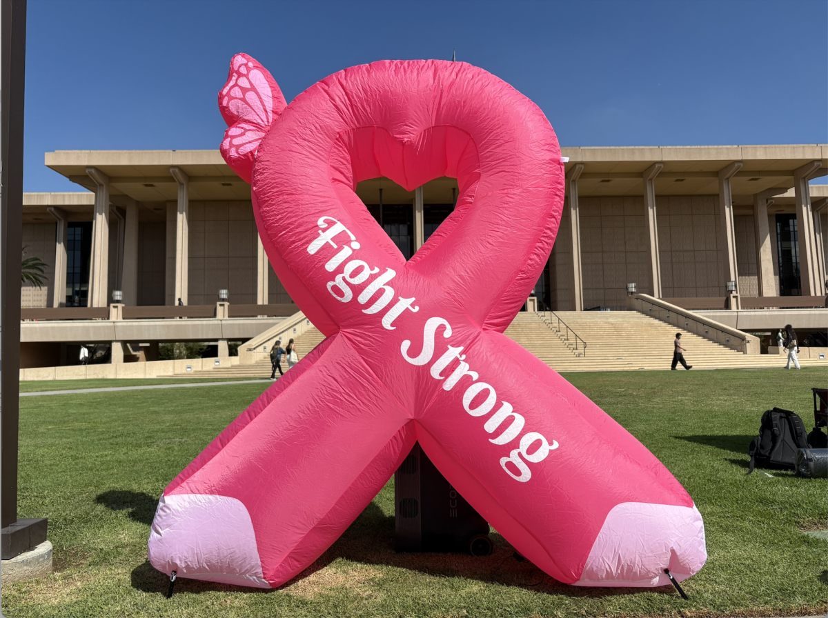 A large blow-up in the shape of a breast cancer awareness pink ribbon stood tall on the CSUN Library Lawn on Wednesday, Oct. 1, 2025, for the first day of breast cancer awareness month.