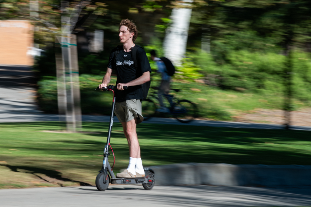 A student rides an e-scooter on CSUN campus on Oct. 8, 2025.