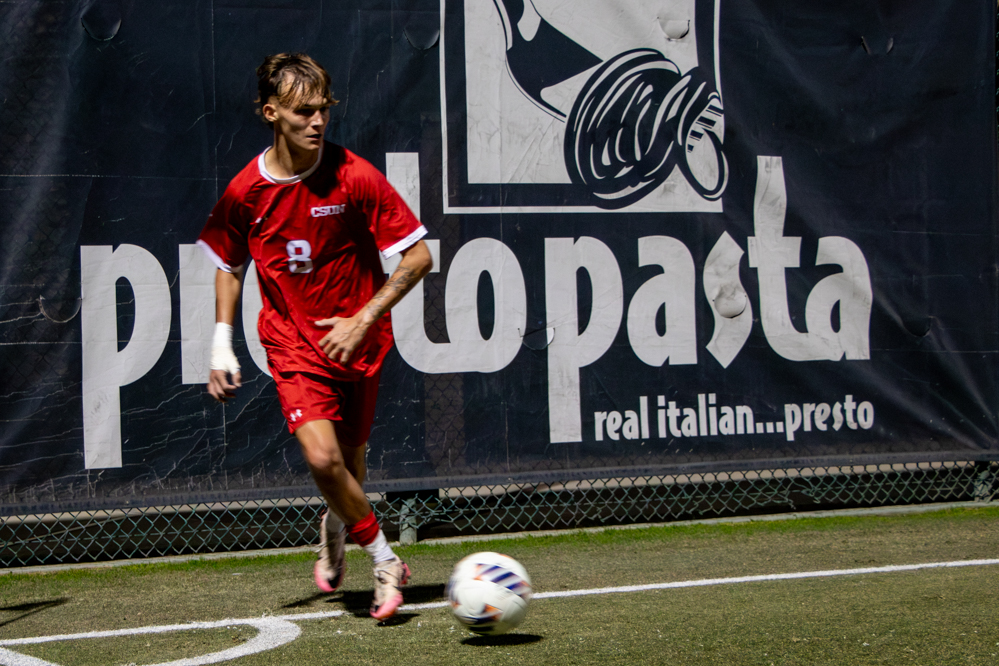 Midfielder Zack Harris kicks the ball back into play during a game against UC San Diego on Oct. 18, 2025.