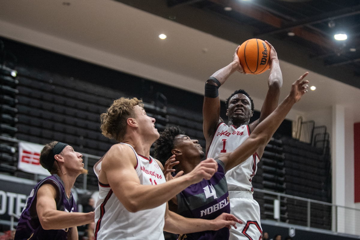 Players attempt to block Davius Loury's (1) shot during a game against the Noble Knights in Northirdge, Calif., on Nov. 3, 2025. The Matadors won 99-58.