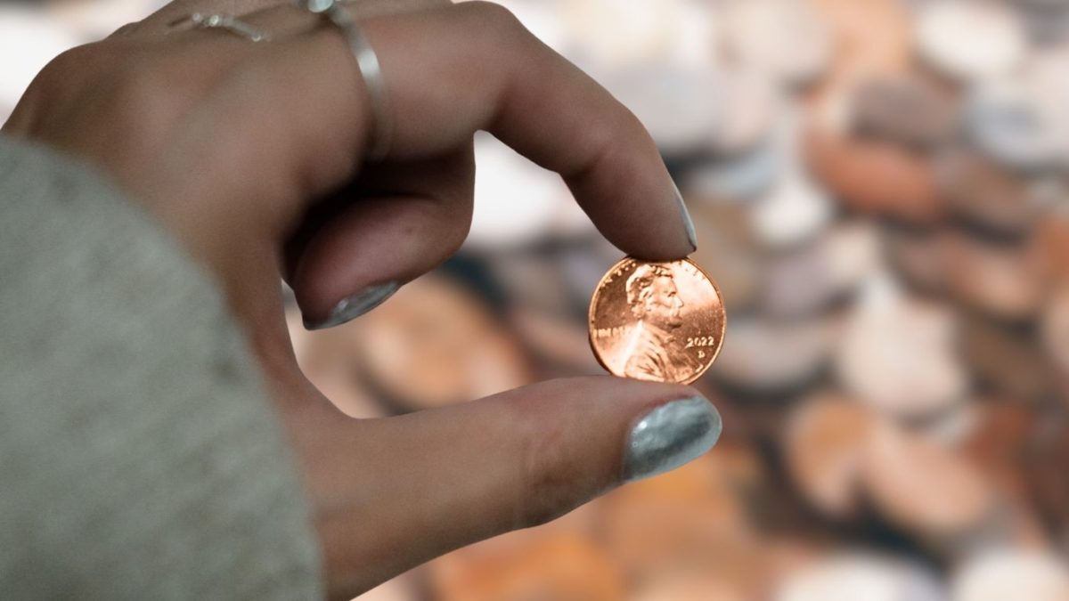 A photo illustration of a 2022 penny being held up. On Nov. 12, 2025, the final penny was pressed in Philadelphia. 