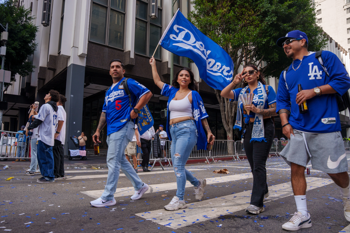 A group of fans continues the celebration decked out in Dodger Blue in Los Angeles, Calif., on Nov. 3, 2025.