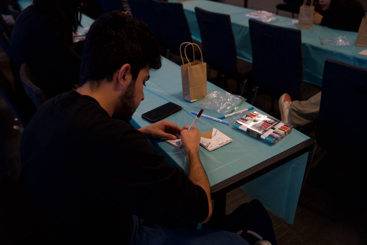 Avean Kallgren, an attendee of the Beat the Blues event working on his kintsugi art activity at CSUN in Northridge, Calif., on Nov. 20, 2025.