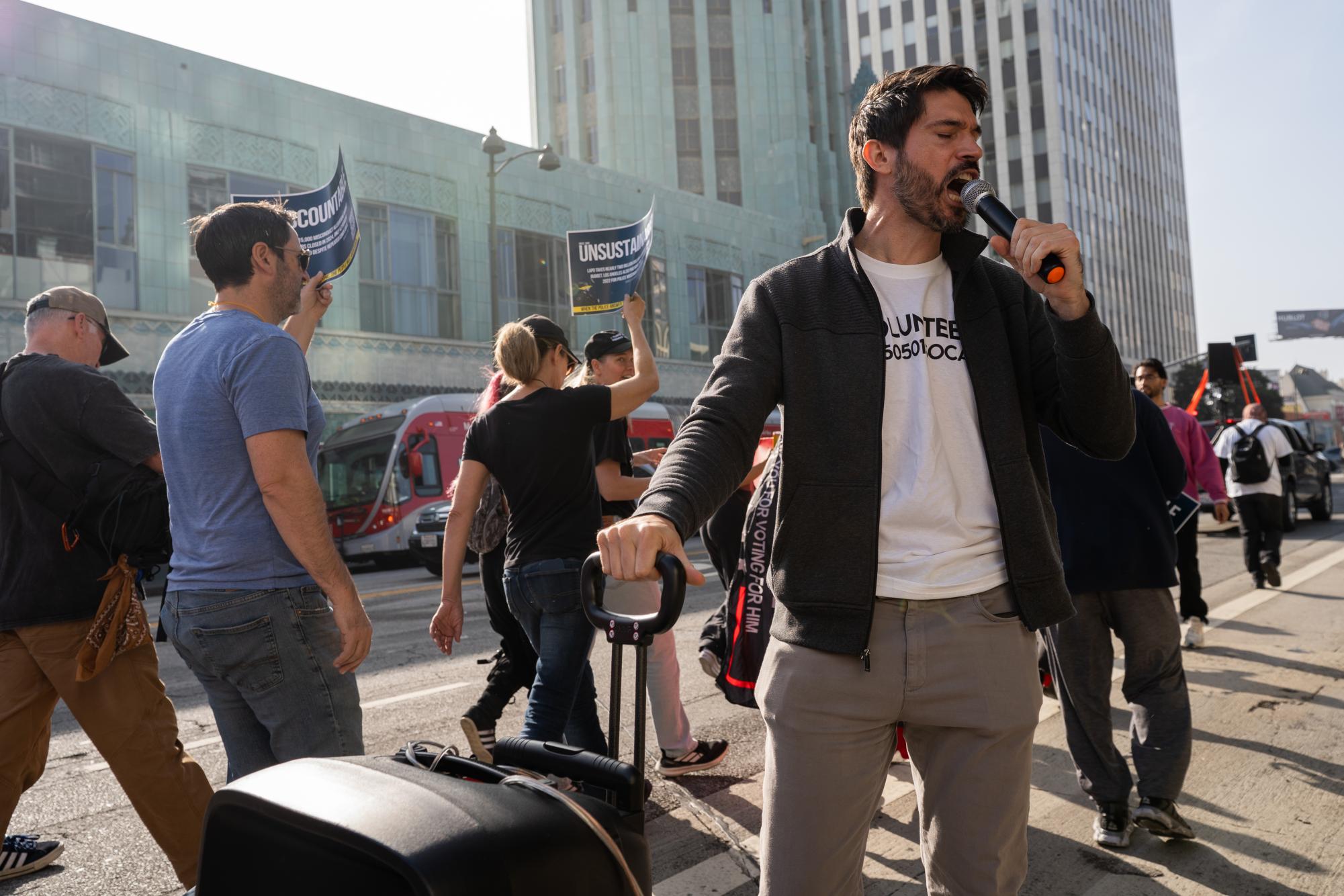 Protesters march down Wilshire boulevard to the Getty House, the residence of Los Angeles Mayor Karen Bass on Dec. 13, 2025, in Los Angeles, Calif. They bring with them a list of demands to bring reform and accountability to the Los Angeles Police Department.