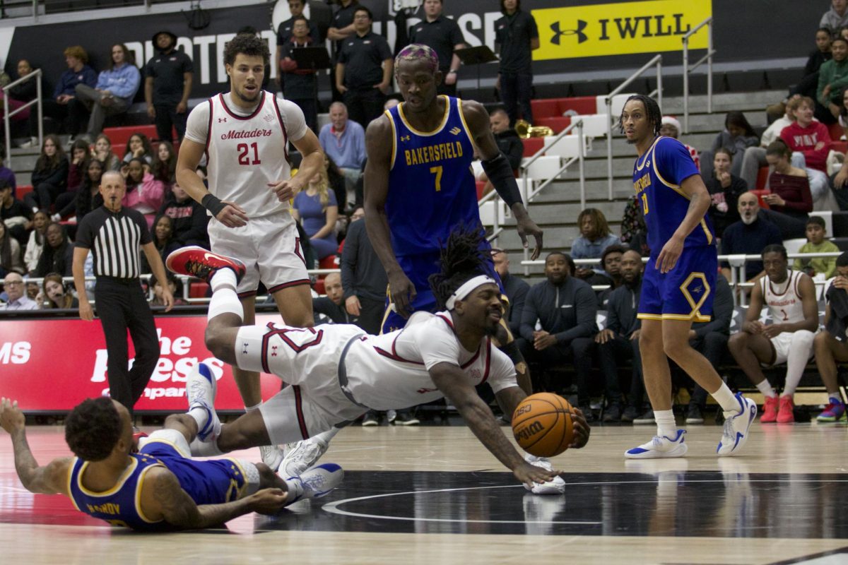 Guard Josiah Davis dives for loose ball against CSUB in the Premiere America Credit Union Arena in Northridge, Calif. on Dec. 4, 2025.