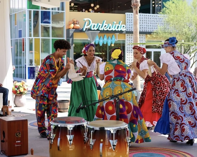 Dancers from the Afro-Peruvian Experience perform with Nadia during a Disney event at Parkside Market in Anaheim.
