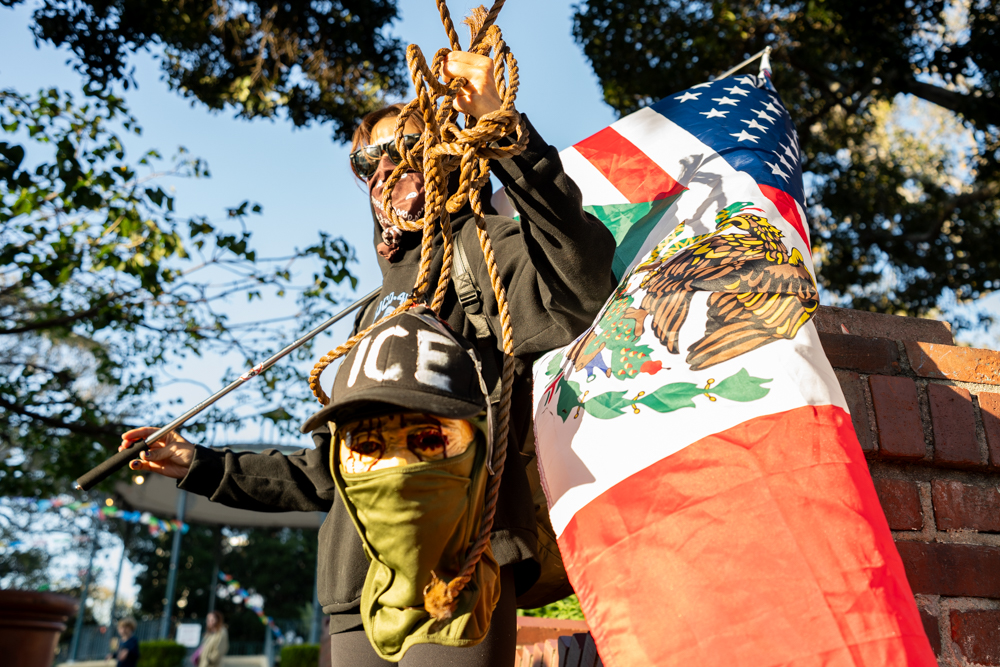 A protester holds a fake severed head representing that of an I.C.E's agents at Olvera Street on Saturday, Jan. 24, 2026, in downtown Los Angeles, Calif. The protest assembled in solidarity with the recent killing of 37-year-old Nurse Alex Pretti in Minneapolis that morning.
