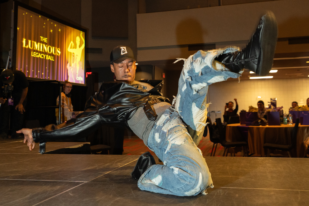 Attendees of the Luminous Legacy Ball are called to the runway where they strut and dance as the crowd chants their name in the USU Building on Saturday, Feb. 14, 2026, in Northridge, Calif.