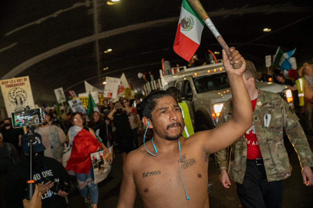 Anti-ICE protesters march from Los Angeles City Hall to Boyle Heights along Cesar Chavez Avenue on Friday, Jan. 30, 2026, in Los Angeles, Calif.