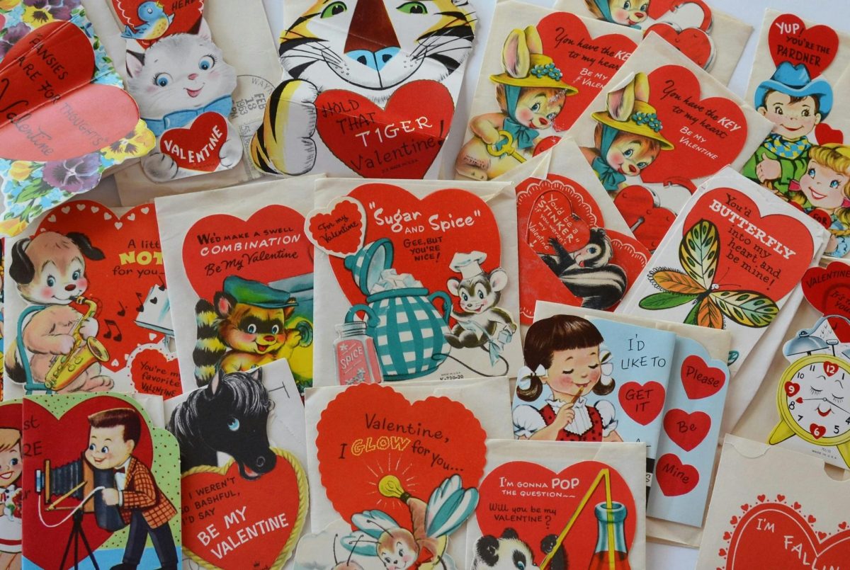 Vintage Valentine's Day cards scattered around. Photo by Susan Holt Simpson via Unsplash.