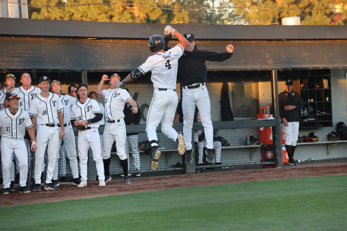 Kyle Panganiban celebrates with his team after his homerun at Robert J. Hiegert Field in Northridge, Calif. on Feb. 13, 2026.