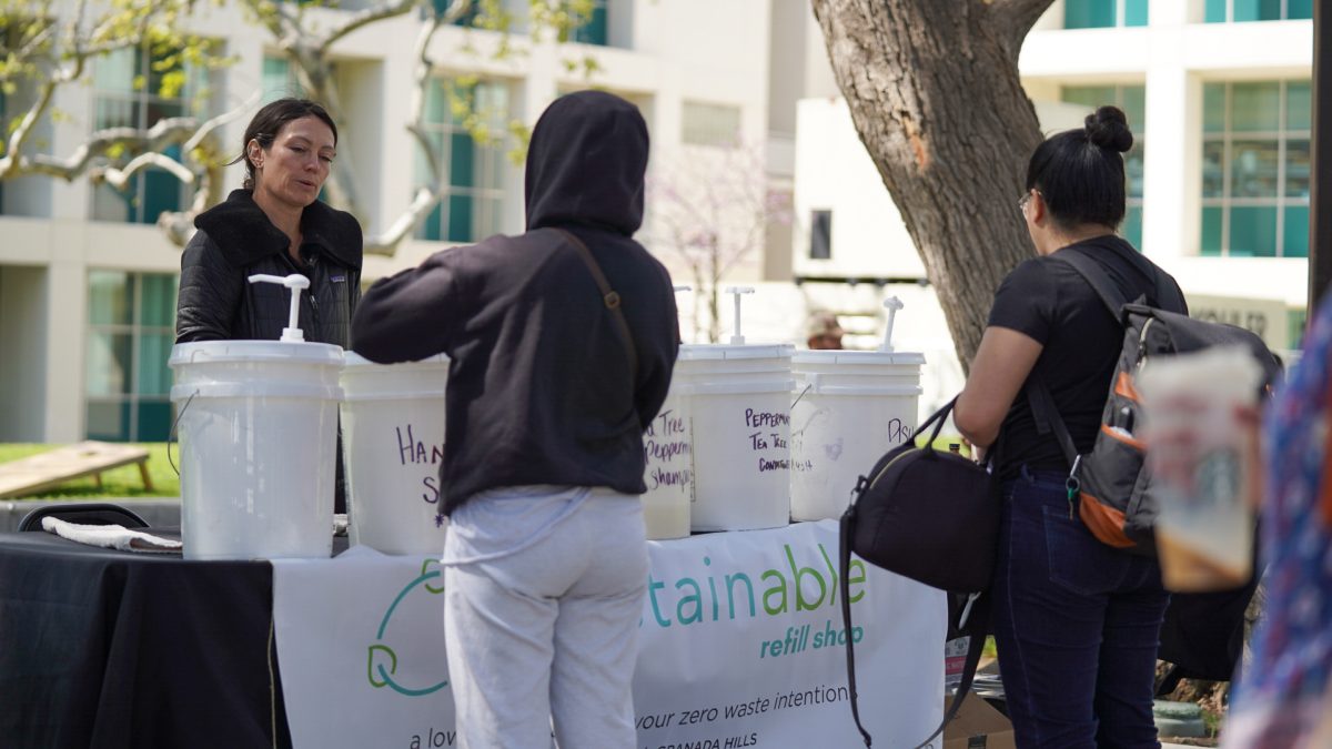 Refill and Repair volunteer, Laura Yochum, helps students out at her Prostainable table at Matador Square on 3/26/24.