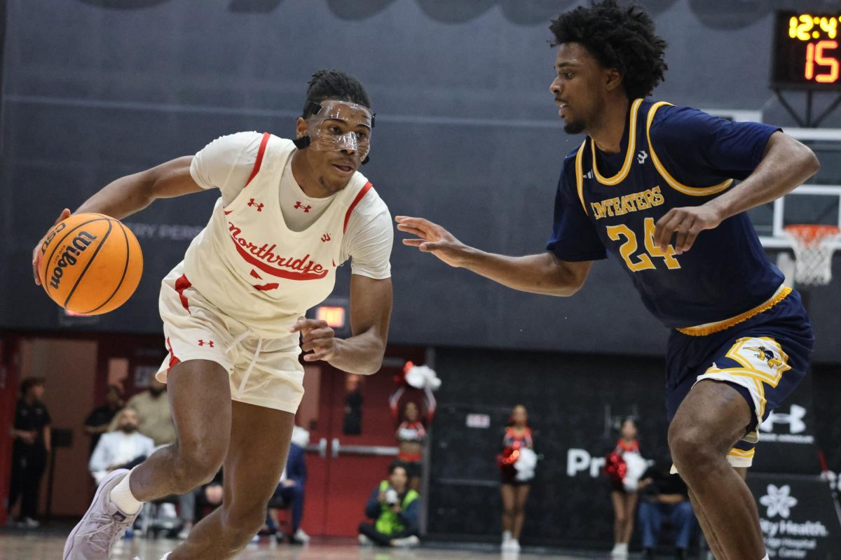 Joshua O'Garro drives the court in an attempt to get some points at the Premier America Credit Union Arena on Feb. 26, 2026.