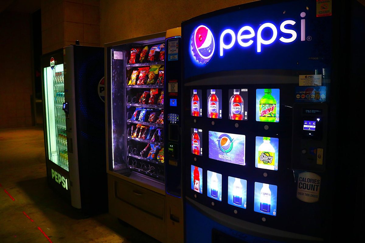 Vending machines offering snacks and drinks stand outside Sierra Hall at California State University Northridge, providing one of the few late-night food (snacks) options available to students on campus. 