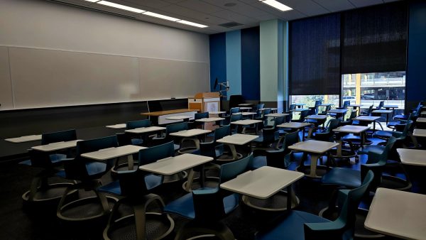 Empty classroom with desks and whiteboard in Maple Hall, Room 327 at CSUN ready for an In-Person Class. 