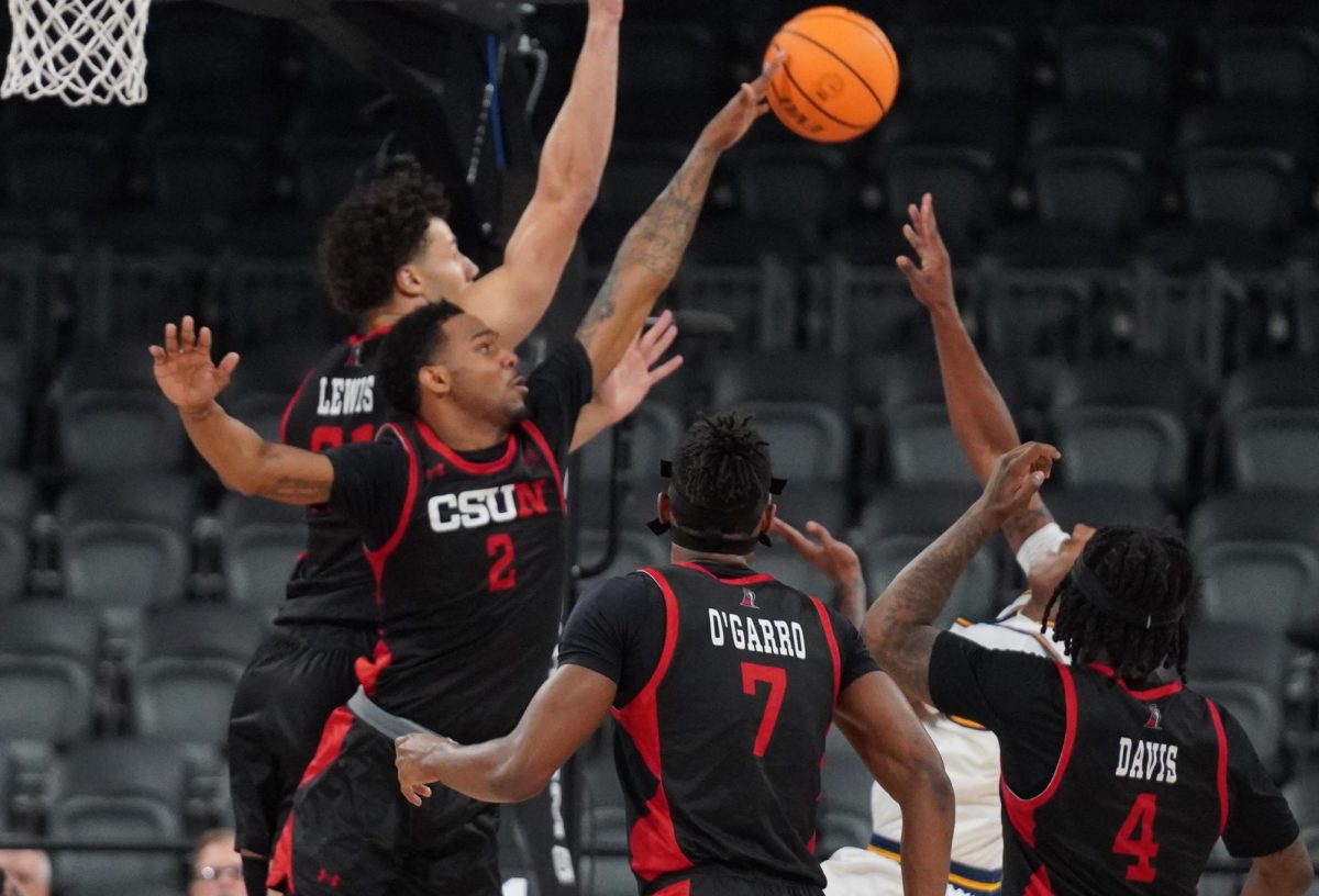 Players from the CSUN basketball team block the ball during a semifinal match against UCI at Lee's Family Forum in Henderson, Nev. on March 13, 2026.