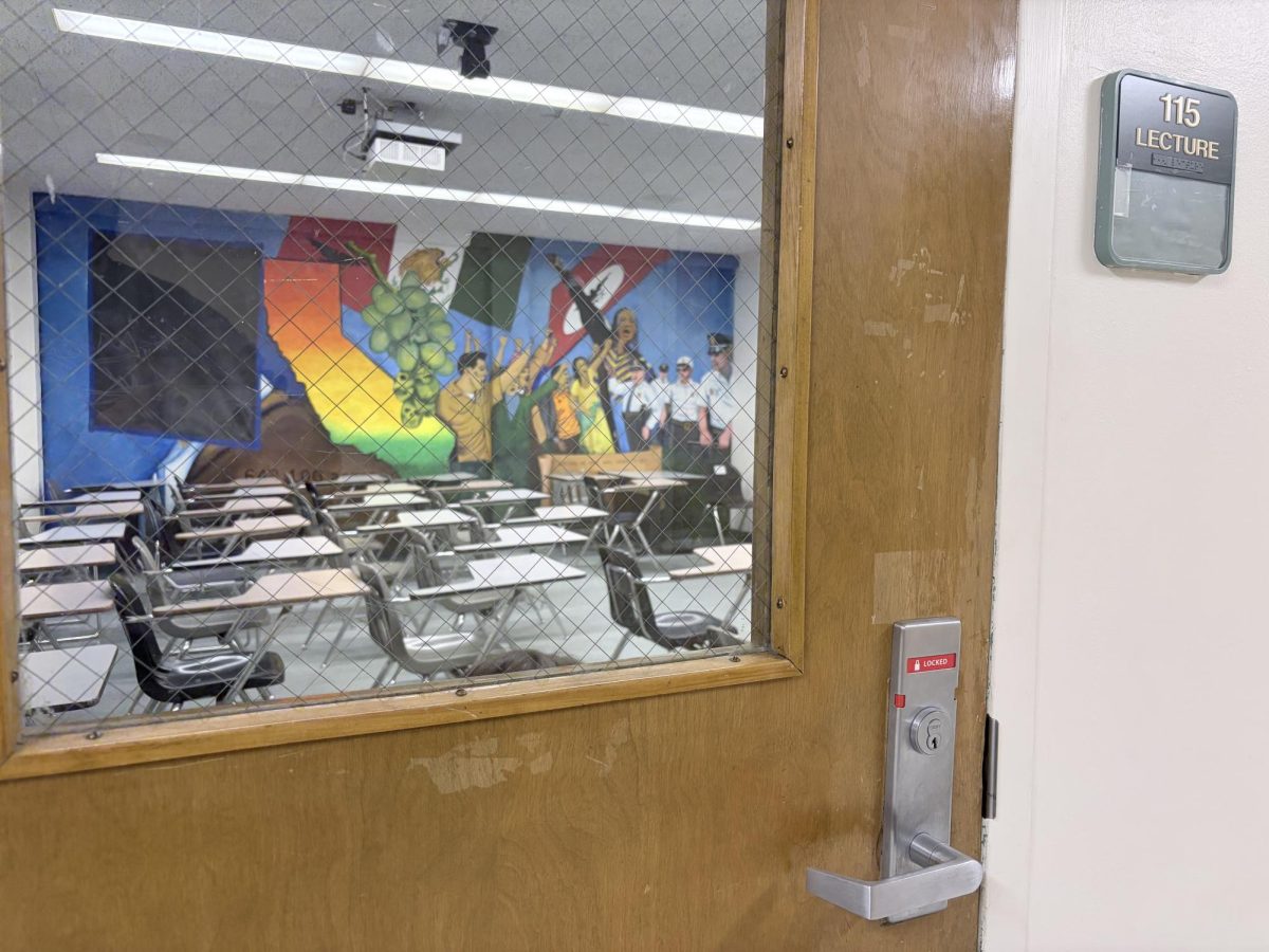 A mural depicting the face of Cesar Chavez is taped over with black paper in Jerome Richfield Hall on April 30, 2026, in Northridge, Calif.