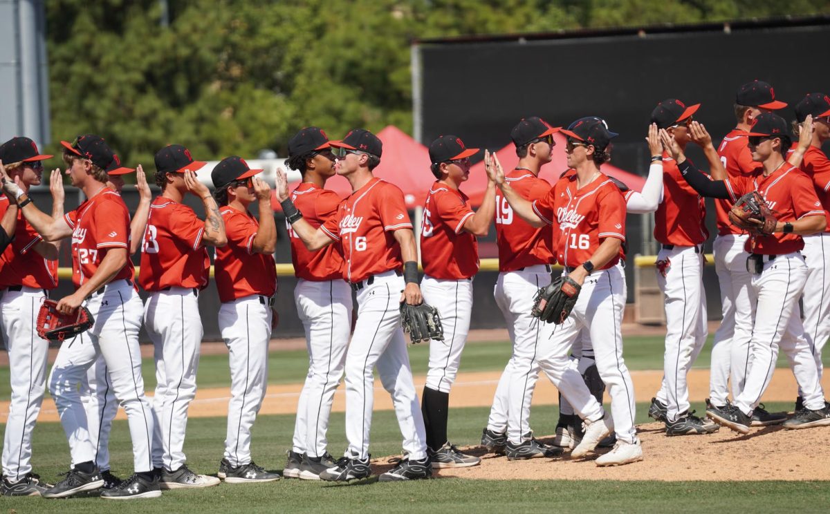 Matadors forming a high-five line after a victory against UC Davis at Robert J. Hiegert Field on April 19, 2026.
