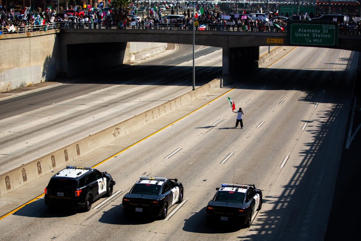 101 Freeway in front of three California Highway Patrol cars during a protest of President Donald Trump’s anti-immigration policies in Los Angeles, Calif., on Sunday, Feb. 2, 2025. Hundreds of protestors joined him after, resulting in a freeway closure.