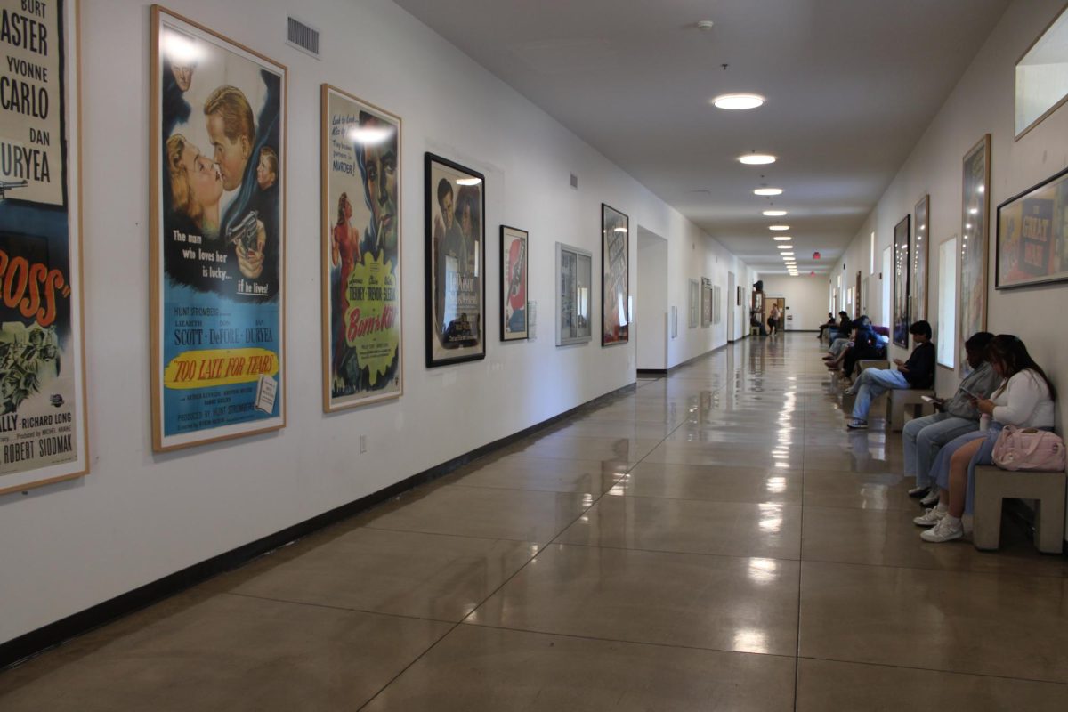 Students sit in CSUN's Manzanita Hall in front of movie posters on May 6, 2026, in Northridge, Calif.